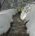 A T.U.D. worker walks along the ditch system