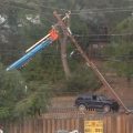PG & E crews repairing power pole after accident