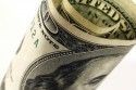 Finance - rolled 100-dollar bills