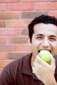 Health - man eating apple