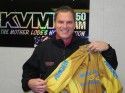 Darrell Slocum holding the Amgen jersey