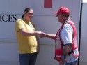 Evacuee Mindi Young shakes hand with Red Cross Volunteer