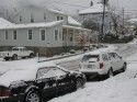 Snow covered cars in downtown Sonora
