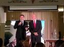 SRMC CEO Andrew Jahn presents the Irving J. Symons Award to Dick Pland
