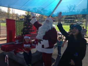 Clarke Broadcasting Cash and Coat Drive and Santa Fly-In for Interfaith, Santa and MaryAnn Curmi, Host of the Morning Star Cafe on KZSQ 92.7