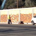 Painting retaining wall along Mono Way