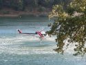 Cal Fire tanker helicopter sucking water from Pine Mountain Lake