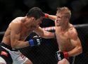 T.J. Dillashaw (R) lands a punch against Renan Barao (L)