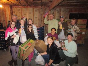 Sierra Bible Church volunteers, about 75 in number, help with packing ahead of the ATCAA Food Bank Thanksgiving Distribution 2015
