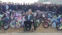 Fire Captain Sue Arrouzet Surrounded By Bikes And Firefighters