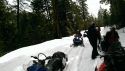 Snowmobilers with rescuers