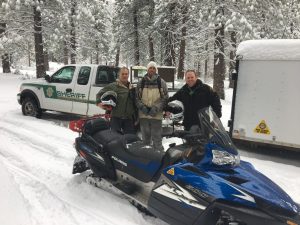 From Left- Search and Rescue member Steve Shields, Found hiker Eric Vanwambeke, and Deputy Sheriff Kyle Johnson.