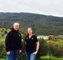 PAWS Co-founder Ed Stewart and Veterinary Director Dr. Jackie Gai outside the center, overlooking the elephant barns.