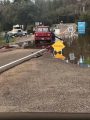 Fire truck pumping flood waters from Parrotts Ferry Road