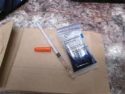 Needle and drugs found