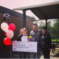 Curtis Creek Third Grade Teacher Holly Acevedo holding $2,500 check surrounded by local Farmers Insurance Agent Leon Curtis and staff members Susan Walbridge and Carolyn King