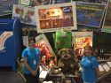 Lisa Mayo and Anna Davies stand in front of the TCVB Booth.