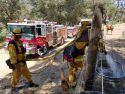 Mountain View Fire Dept showing Mutual Aid-plus during Detwiler Fire, filling a water trough for local horses.