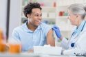 Handsome African American man receives flu shot