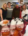 Monica Fox, Tribal Administrator for Chicken Ranch Rancheria, Deni Avery, ATCAA’s Tuolumne Food Bank Director, and Heidi Diestel of Diestel Turkey Ranch (and a turkey)