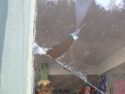Broken window at the Community Thrift Shop