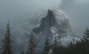Yosemite Conservancy webcam view of Yosemite Half Dome from Sentinel Dome captured Dec 20 2017 just before noon.