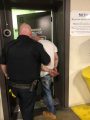 Edward Cooper in handcuffs