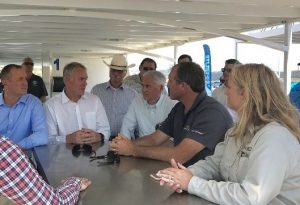 L-R Jeff Denham, Ryan Zinke and Tom Mclintock listen to concerns while on a pontoon boat at New Melones