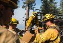 Ferguson Fire firefighters unload supplies for suppression efforts