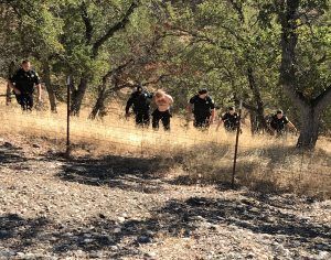 Calaveras County deputies lead arrestee Nicholas Kohring from Highway 26 Valley Springs residence CCSO Photo