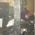 Burnt wooden beam under Intake Bar building