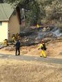 Vegetation fire behind a Soulsbyville home
