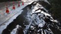 Section of pavement damaged on HWY 26 east of Glencoe