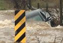 Vechile submerged in flood waters on Sims Road in Chinses Camp area