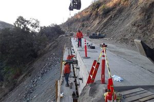 Crews working on the Marshes Flat Road concrete ledge in the Moccasin area of Tuolumne County