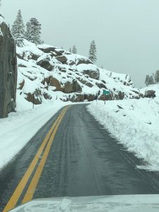 Highway 108 Sonora Pass with snow on the roadway from recent storm system