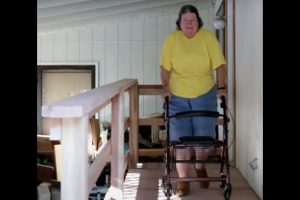 Margo using her ramp built by Habitat Home Repair Program