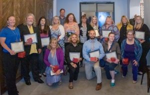 Pictured from left to right: Top Row: Melissa Stegall, Tyler Vogel, Elisa Villa-Root, Kelli O’Brien, Kevin Williams, Bonnie Cozad, Lorraine Lewis, Danielle Riley, Catherine Acly, Shary Trent, Mahaila Ford Bottom Row: Julie Chaffee, Chase Bulkin, Will Sarkisian, Leah Gissler, Kathy Kenna