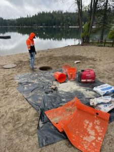 Crews member working on manhole rehabilitation