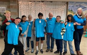 Mentors and mentees showing the t-shirts