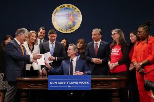 Governor Gavin Newsom sings gun laws