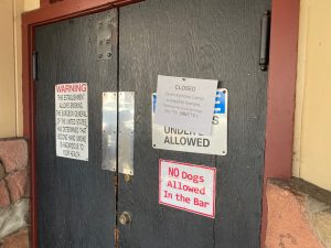 Zane’s Iron Horse Lounge with notice of its closure on the door -- Photo taken by BJ Hansen