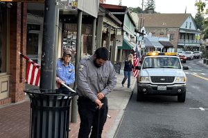 SPD officers put up flags along Washington Street in downtown Sonora as a symbol of unity and respect—SPD photo